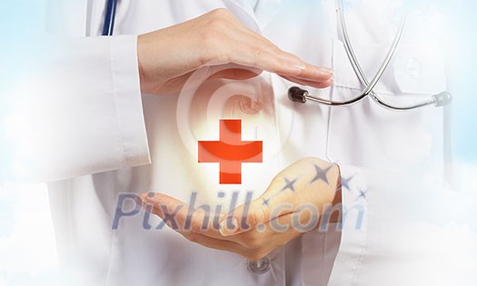 Close up of doctor hands with medicine cross sign Close up of doctor hands with medicine cross sign