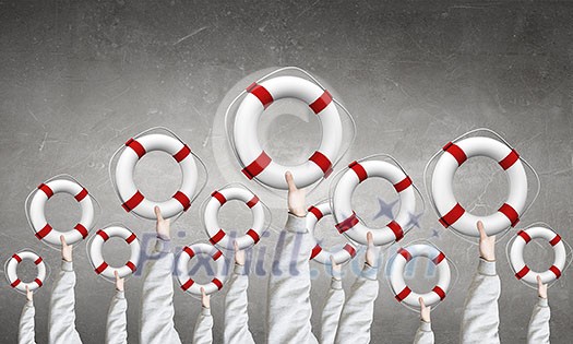 Group of business people holding lifebuoy in raised hands Group of business people holding lifebuoy in raised hands