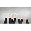 Group of business people holding in hands cards with letters 
