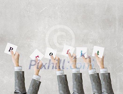 Group of business people holding in hands cards with letters Group of business people holding in hands cards with letters