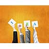 Group of business people holding in hands cards with letters 
