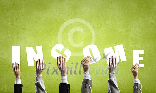 Group of business people holding in hands cards with letters Group of business people holding in hands cards with letters