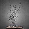 Opened book with characters flying of pages