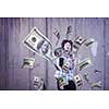 business, people and finances concept  Happy young businessman throwing US dollar banknotes and enjoying while making the rain of money in new startup office