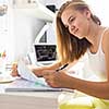 Teenage girl studing for school on a sunny Sunday morning