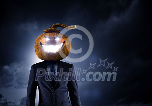 Big orange pumpkin on dark background. Mixed media Big orange pumpkin on dark background. Mixed media