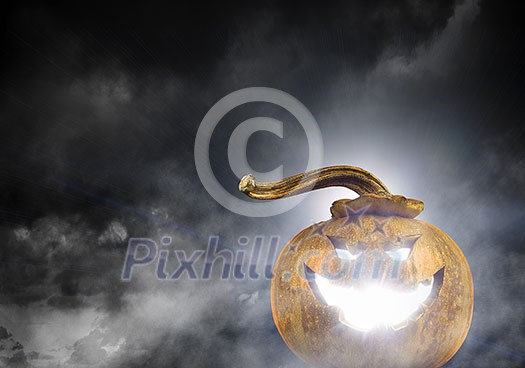 Big orange pumpkin on dark background. Mixed media Big orange pumpkin on dark background. Mixed media
