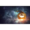 Big orange pumpkin on dark background. Mixed media