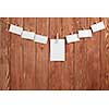 Blank sheets of paper hanging on rope