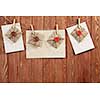 Envelopes hanging on rope on wooden background