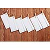 Envelopes hanging on rope on wooden background