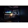 Dark office interior with graphs and diagrams. Mixed media