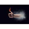 Young businessman holding fire flames in palm