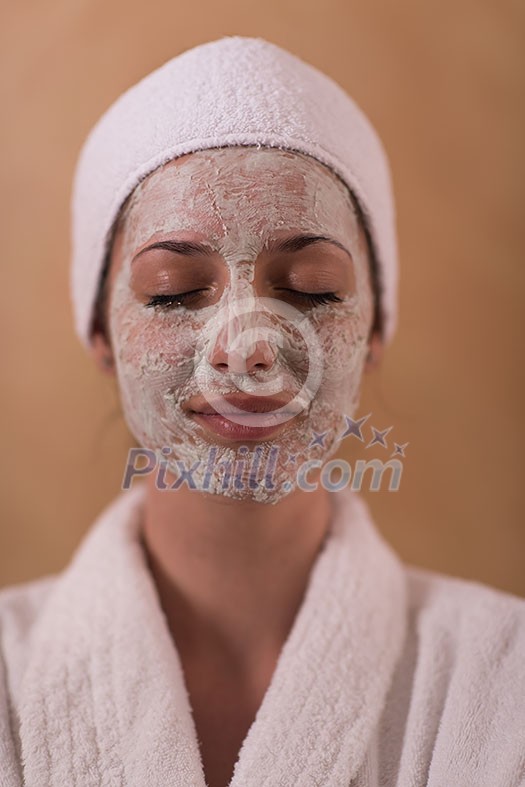 Spa Woman applying Facial Mask Beauty Treatments Close up portrait of beautiful girl with a towel on her head applying facial mask Spa Woman applying Facial Mask Beauty Treatments Close up portrait of beautiful girl with a towel on her head applying facial mask