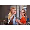 friends together at school, two student girls with backpack and tablet on university