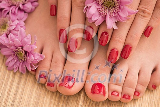 Closeup photo of a female feet and hands at spa salon on pedicure and manicure procedure Closeup photo of a female feet and hands at spa salon on pedicure and manicure procedure