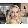 happy young blonde business woman portrait at office