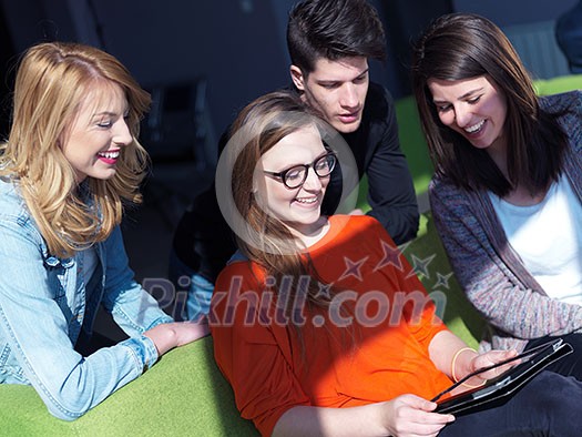 students group working on school project together on tablet computer at modern university, teamwork business concept students group working on school project together on tablet computer at modern university, teamwork business concept