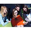 students group working on school  project  together on tablet computer at modern university, teamwork business concept