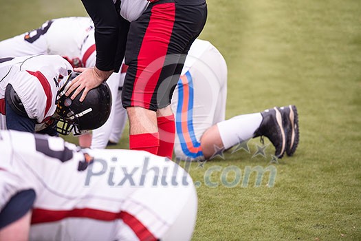 group of young professional american football players in action during training on the field group of young professional american football players in action during training on the field