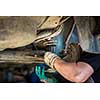 Inside a garage - changing wheels/tires (shallow DOF; color toned image)