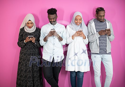 african students group using smart phones with plastic pink background african students group using smart phones with plastic pink background