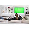 African Couple Sitting On Sofa Watching TV Together Chroma Green Screen Woman Wearing Islamic Hijab Clothes