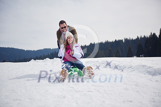 romantic winter  scene, happy young couple having fun on fresh show on winter vacatio, mountain nature landscape