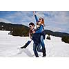 romantic winter  scene, happy young couple having fun on fresh show on winter vacatio, mountain nature landscape