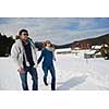 romantic winter  scene, happy young couple having fun on fresh show on winter vacatio, mountain nature landscape