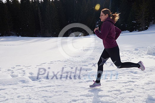 yougn woman jogging outdoor on snow in forest, healthy winter lifestyle and recreation yougn woman jogging outdoor on snow in forest, healthy winter lifestyle and recreation