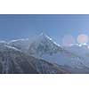 French alps mountain peaks covered with fresh snow. Winter landscape nature scene on beautiful sunny winter day.