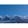 French alps mountain peaks covered with fresh snow. Winter landscape nature scene on beautiful sunny winter day.