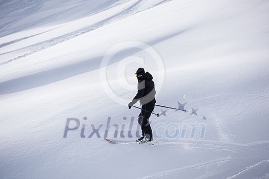 extreme freeride skier skiing on fresh powder snow in downhill at winter mountains extreme freeride skier skiing on fresh powder snow in downhill at winter mountains