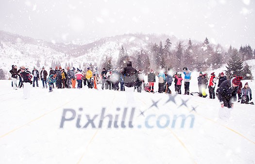 group of young happy business people having a running in bag competition while enjoying snowy winter day with snowflakes around them during a team building in the mountain forest group of young happy business people having a running in bag competition while enjoying snowy winter day with snowflakes around them during a team building in the mountain forest