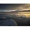 View of the sky and clouds from the airplane porthole. jet engine turbine look through aircraft window