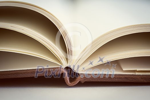 Opened book on the table. Close up. Opened book on the table. Close up.