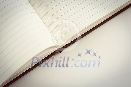 Opened book on the table. Close up. Opened book on the table. Close up.