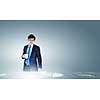 Young businessman and statistics information at background