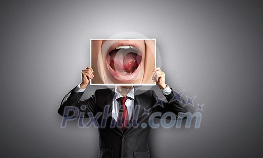 Unrecognizable businessman holding photo with screaming mouth Unrecognizable businessman holding photo with screaming mouth