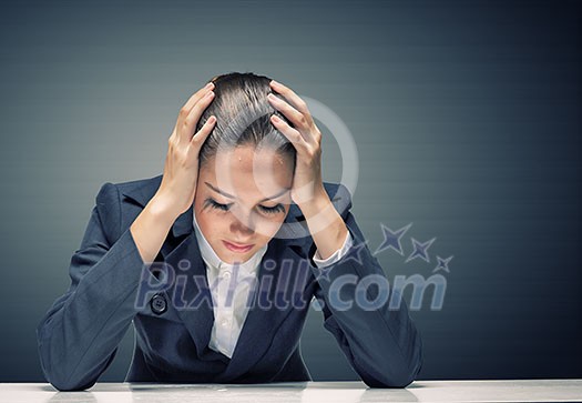Young troubled businesswoman with hands on head Young troubled businesswoman with hands on head