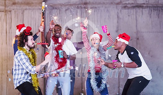 multiethnic group of young happy casual business people dancing and having confetti party while celebrating new year eve in front of concrete wall at new startup office multiethnic group of young happy casual business people dancing and having confetti party while celebrating new year eve in front of concrete wall at new startup office
