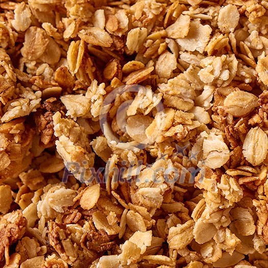 Healthy natural background with oat granola for diet vegetarian eating. Place under text. Top view. Healthy natural background with oat granola for diet vegetarian eating. Place under text. Top view.