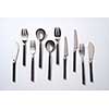 A variety of spoons, knives and forks on a gray background with space for text. Vintage set. Flat lay