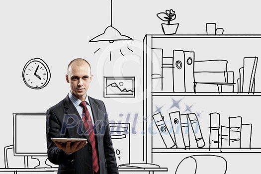 Young confident businessman standing in drawn office Young confident businessman standing in drawn office