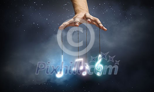 Close up of human hand and items hanging on fingers Close up of human hand and items hanging on fingers