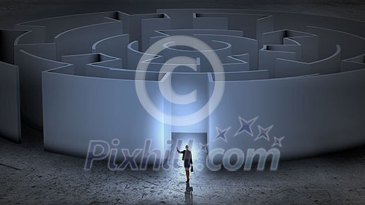 Puzzled businesswoman standing near entrance of labyrinth Puzzled businesswoman standing near entrance of labyrinth