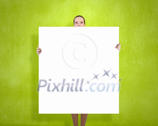 Young woman showing white blank banner. Place for text Young woman showing white blank banner. Place for text