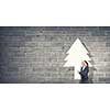 Woman in Santa hat pointing with finger at blank banner. Place for your text