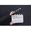 video production movie clapper cinema action and cut concept on balck chalkboard background